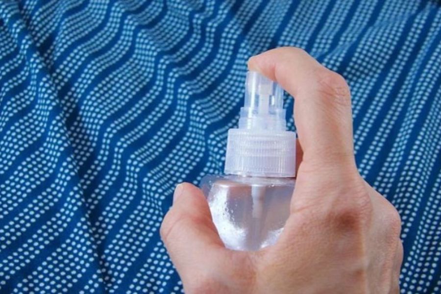 Spray Water On Clothes With A Spray Bottle 